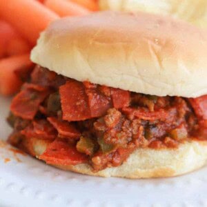 close ups picture of Slow Cooker Pizza Sloppy Joes on a white plate
