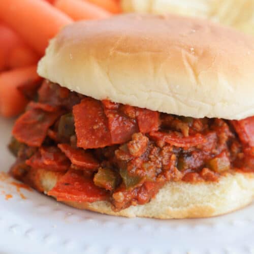 close ups picture of Slow Cooker Pizza Sloppy Joes on a white plate