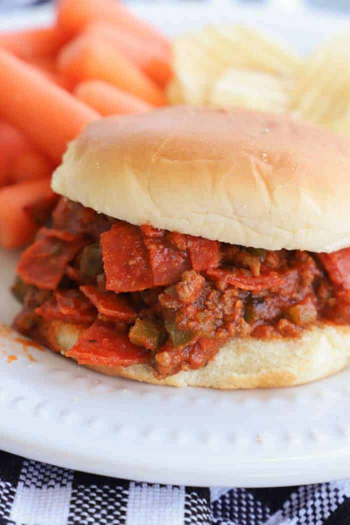 close ups picture of Slow Cooker Pizza Sloppy Joes on a white plate