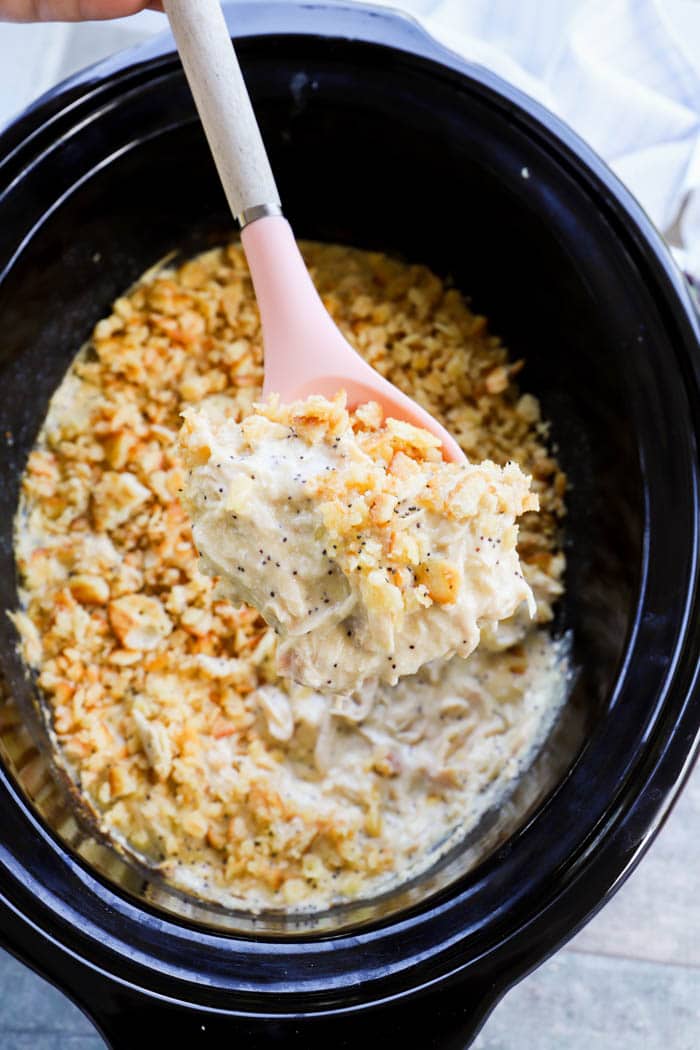 Slow Cooker Poppy Seed Chicken in a pink spoon