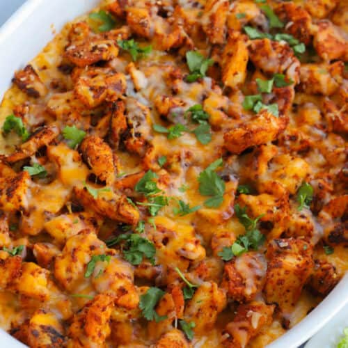 Chicken and Rice Queso Casserole in a white casserole dish
