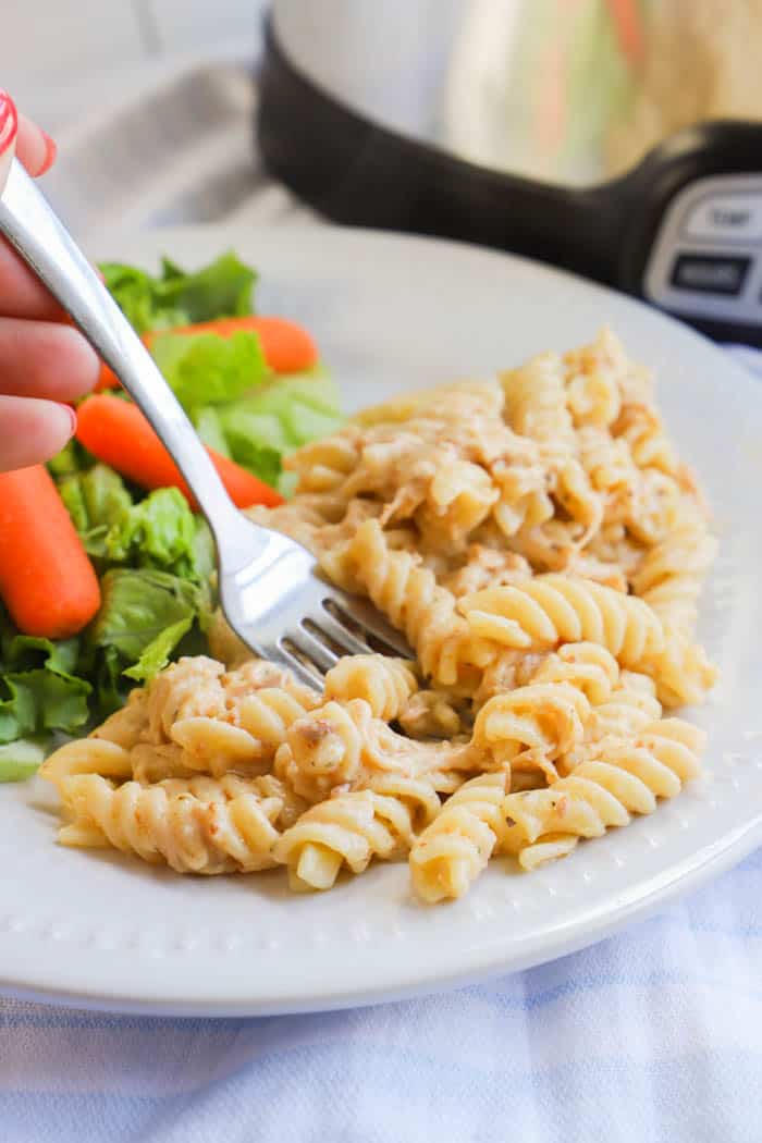 using a fork to eat Slow Cooker Italian Chicken Pasta