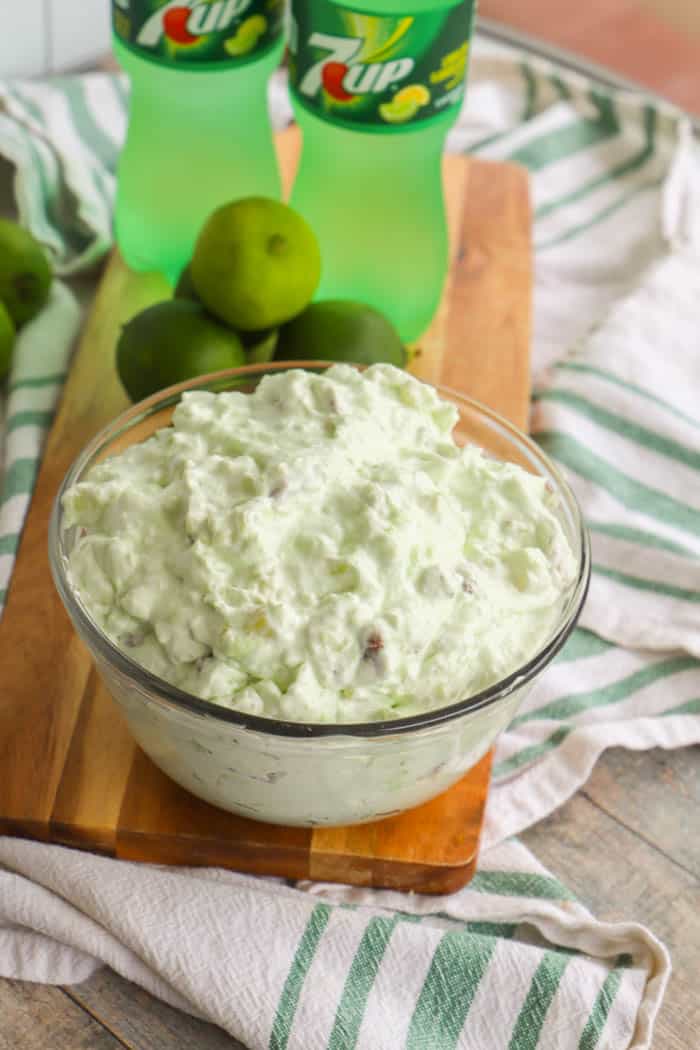 7-Up Salad on a wooden board in a clear bowl