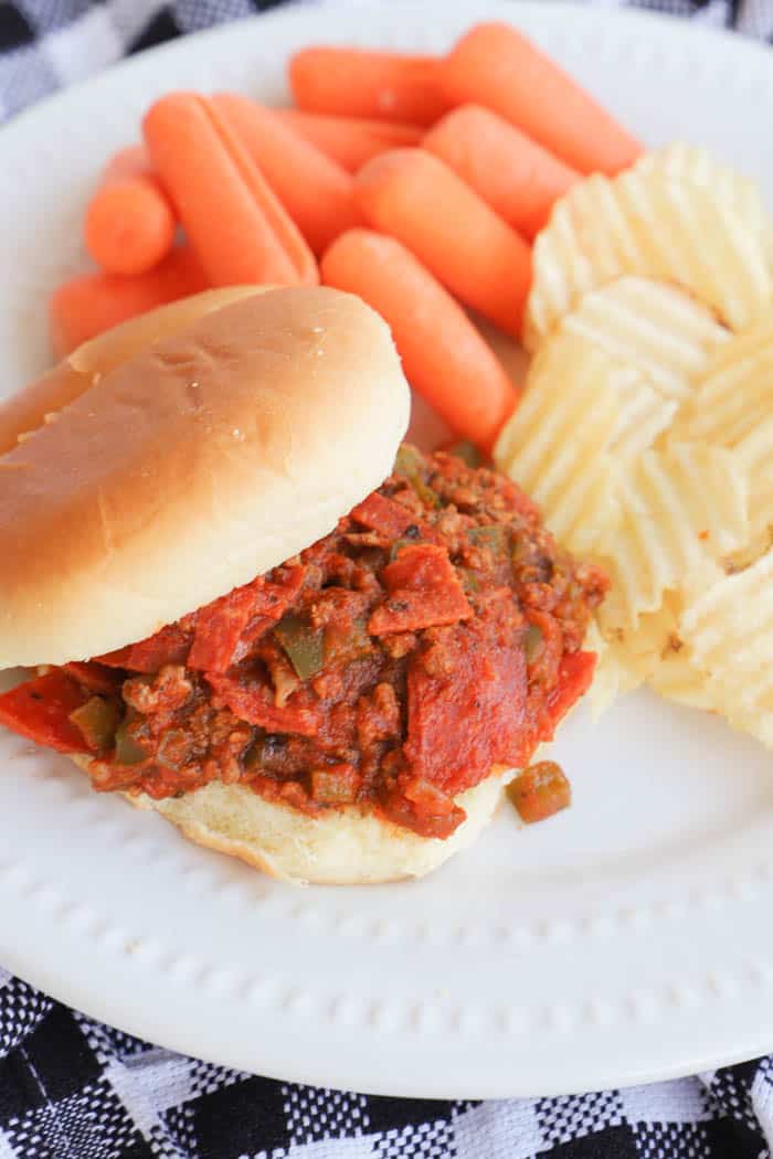 Slow Cooker Pizza Sloppy Joes on a plate with chips and carrots