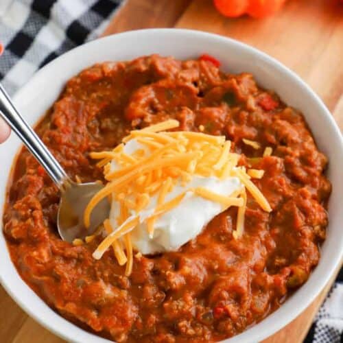 slow cooker pumpkin chili recipe in a bowl with spoon