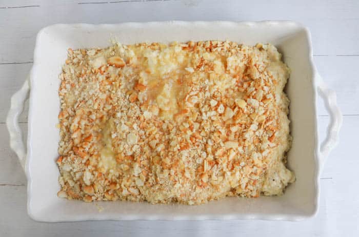 adding crackers to the top of the casserole