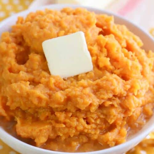 Mashed Sweet Potatoes in a bowl on a yellow polka dot napkin