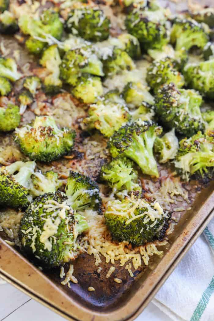 A close up of a tray of food with broccoli