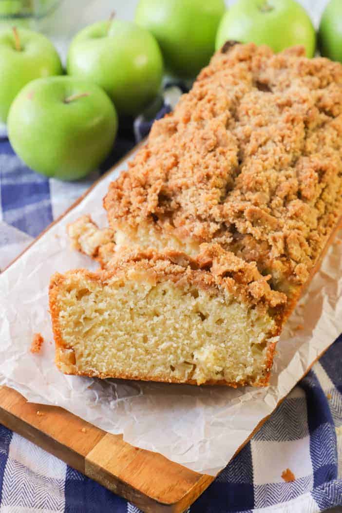 Dutch Apple Pie Bread Sliced on wooden board with apples