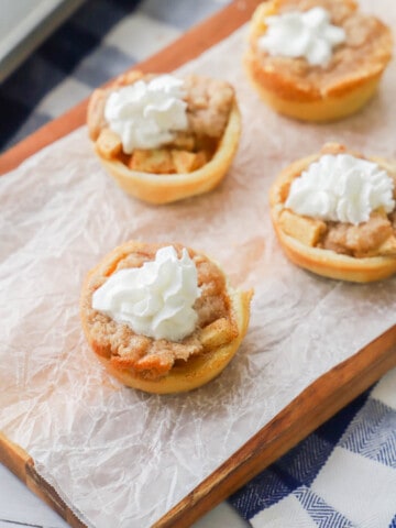 Mini Dutch Apple Pie with whipped cream topping