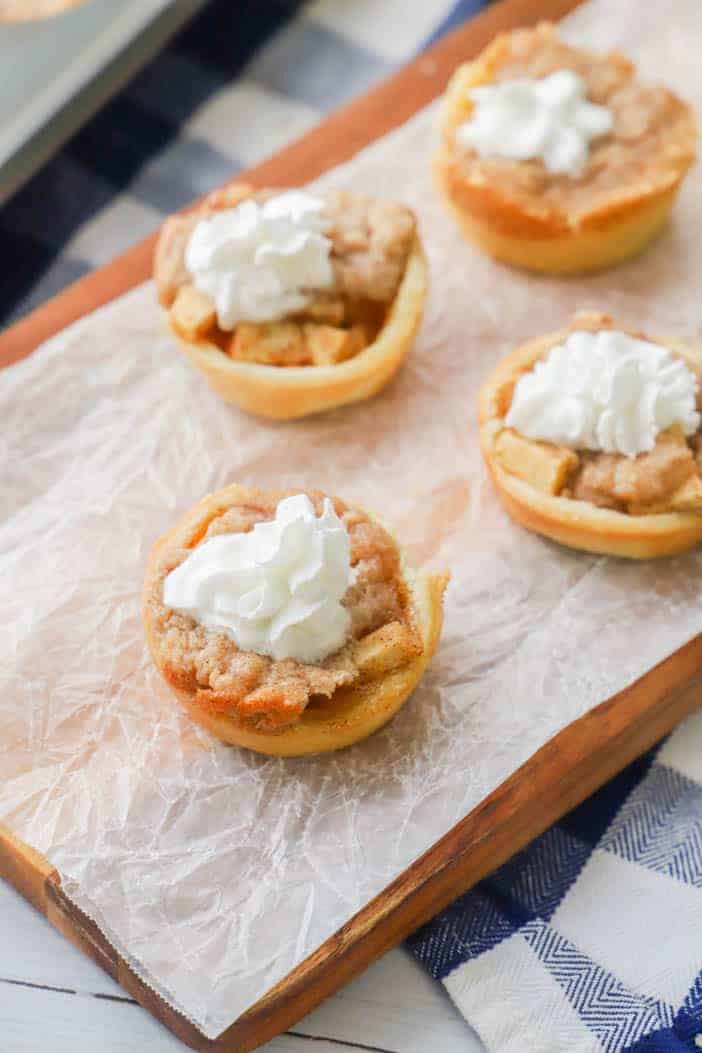 Mini Dutch Apple Pie with whipped cream topping