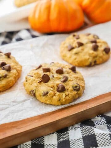 Pumpkin Oatmeal Chocolate Chip Cookie on a wooden cutting board