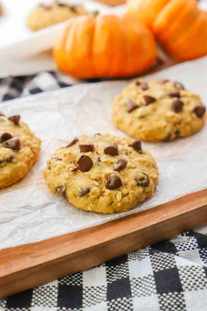 Pumpkin Oatmeal Chocolate Chip Cookie on a wooden cutting board