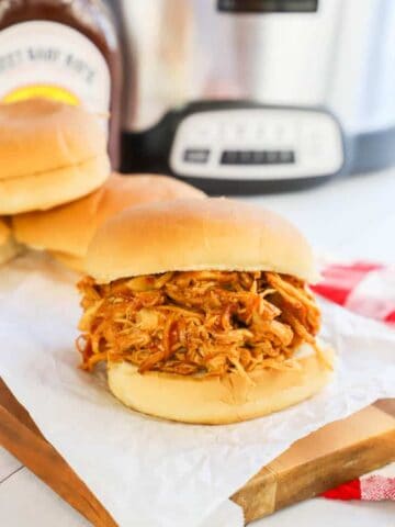 Slow Cooker Pulled BBQ Chicken on a wooden board
