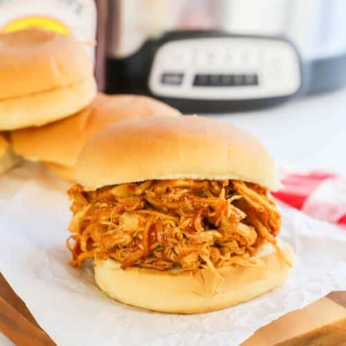 Slow Cooker Pulled BBQ Chicken on a wooden board