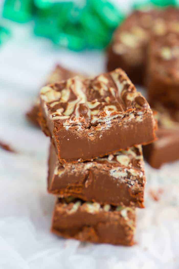 Andes Mint Fudge stacked on parchment paper.