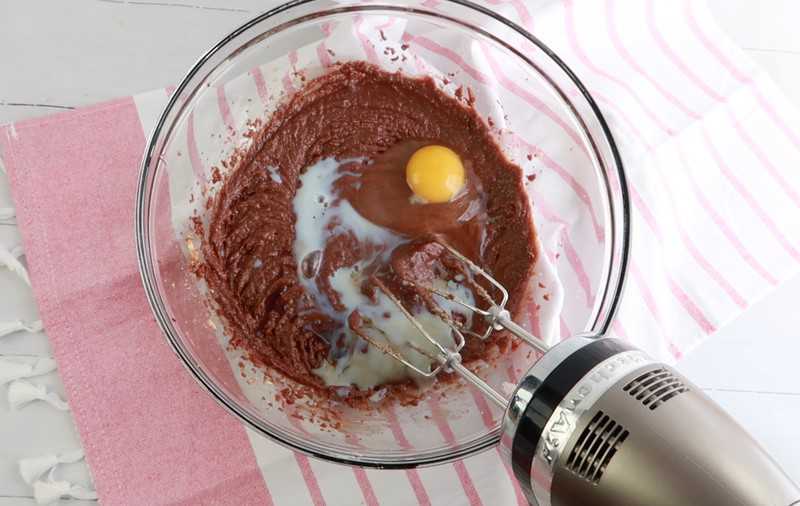 mixing egg and milk in a bowl