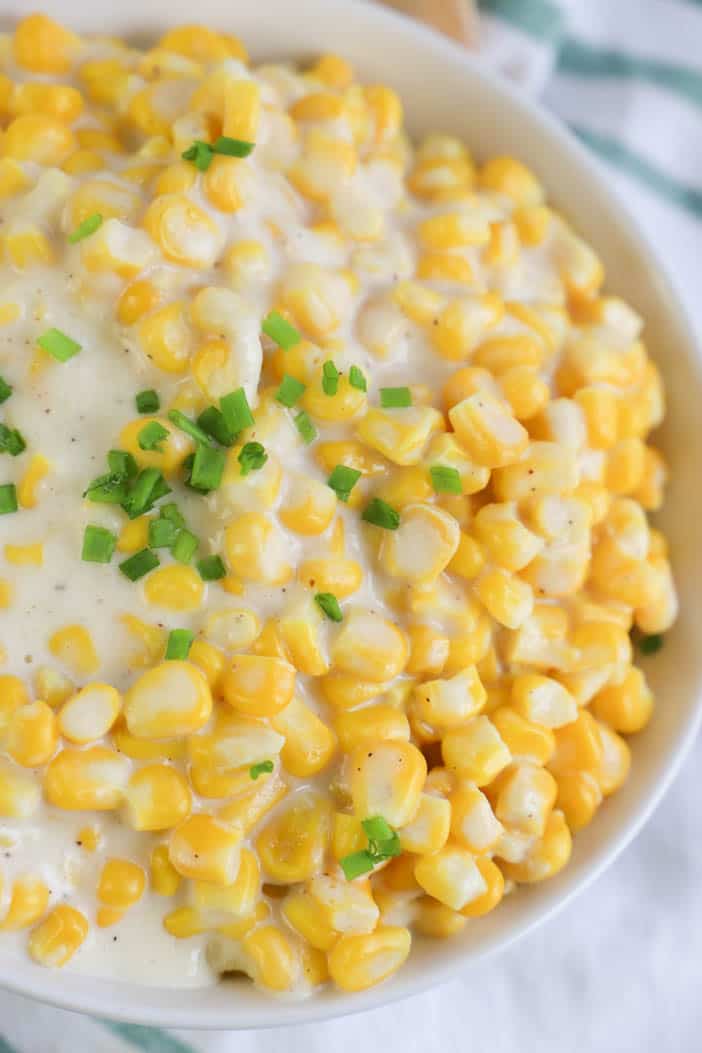 close up picture of Cream Corn with chives on top