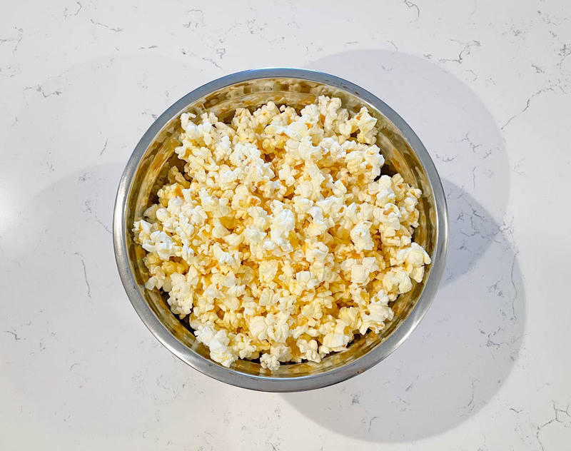 popcorn in a bowl on white counter
