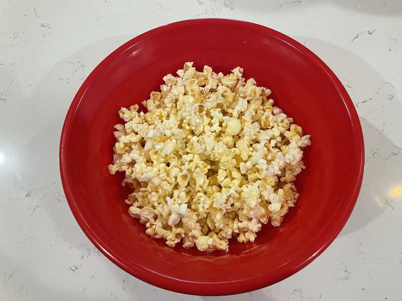 popcorn in a red bowl.