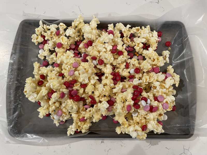 popcorn on a baking sheet cooling.