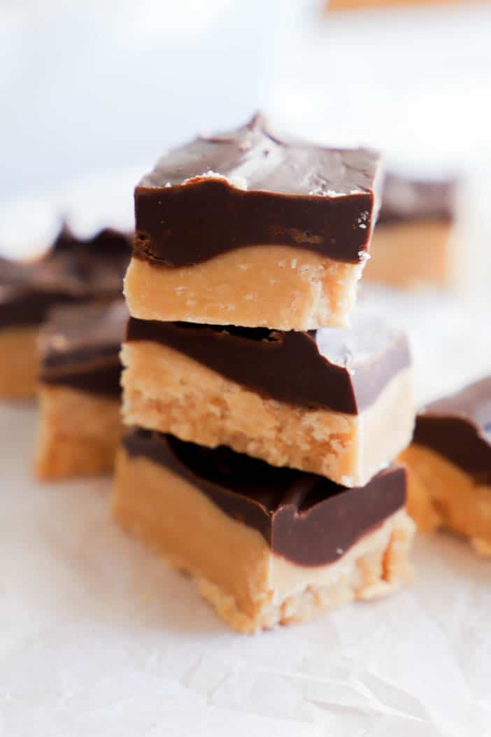fudge stacked on top of each other on white parchment paper