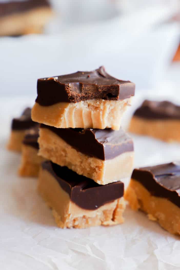 closeup of peanut butter and chocolate fudge stacked on top of each other