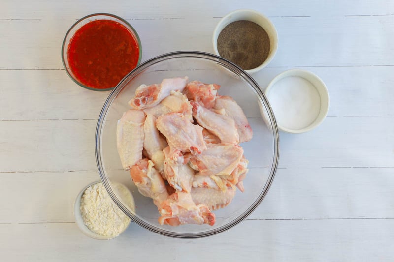 ingredients for baked chicken wings in separate bowls