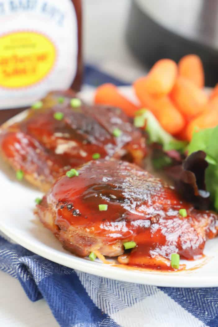 chicken thighs on a plate with salad