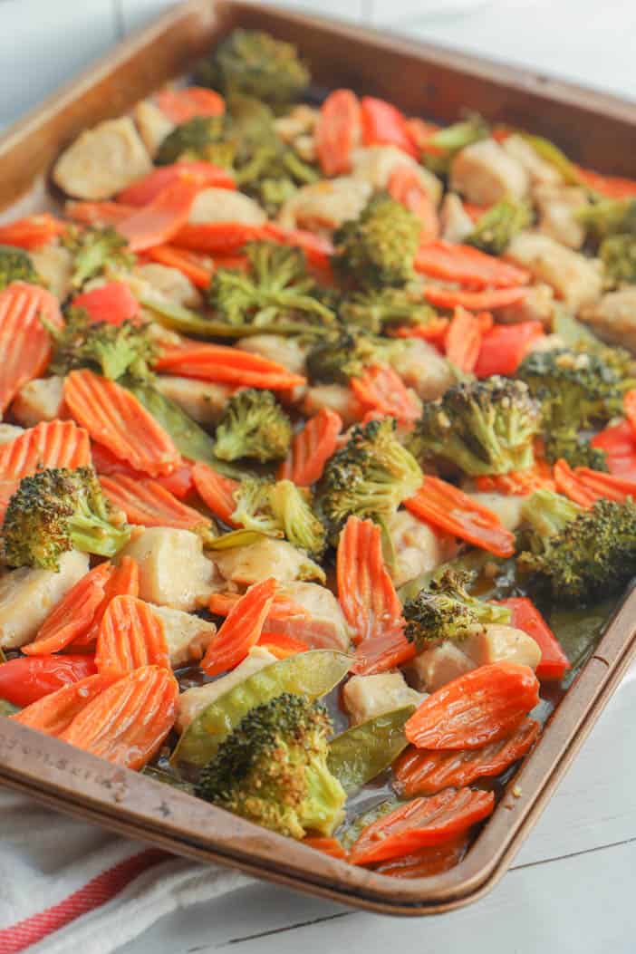 veggies and chicken cooked on the sheet pan