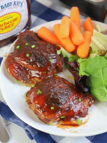 Slow Cooker BBQ Chicken Thighs in a white plate