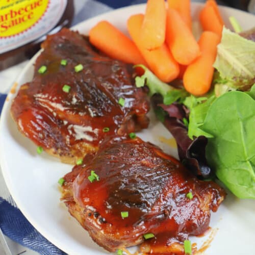 Slow Cooker BBQ Chicken Thighs in a white plate