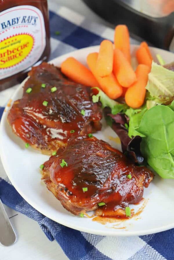 Slow Cooker BBQ Chicken Thighs in a white plate