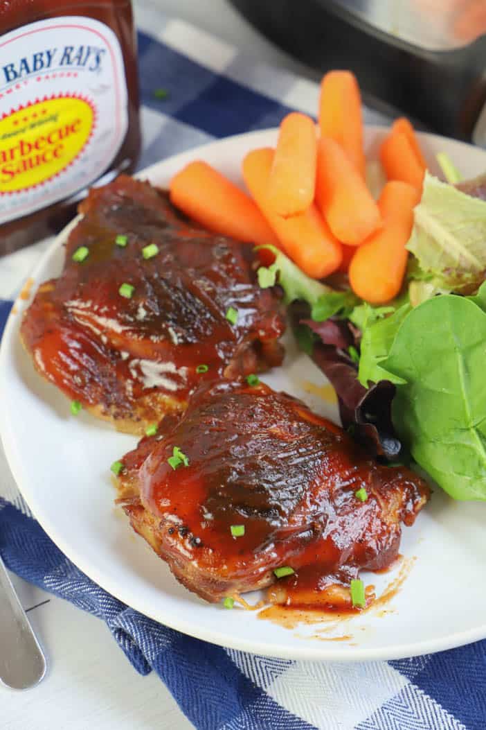 Slow Cooker BBQ Chicken Thighs in a white plate