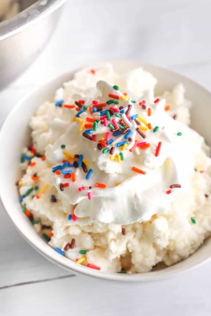 Snow Ice Cream with whipped cream and sprinkles