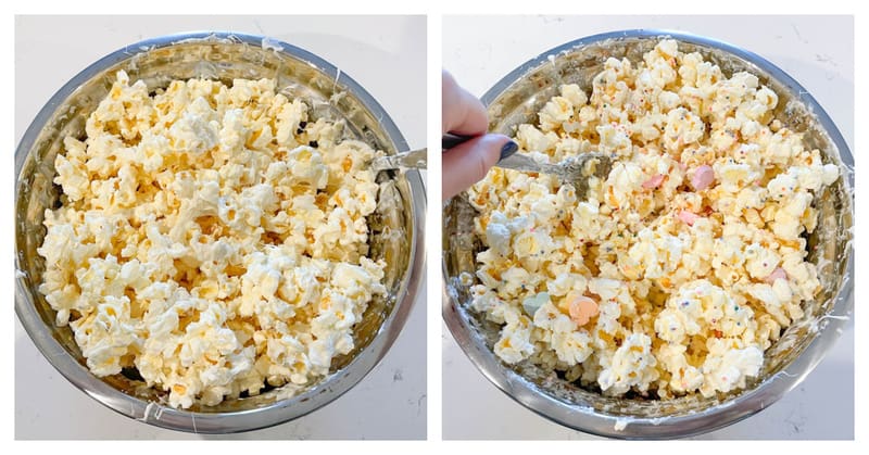 popcorn in a bowl being mixed with white chocolate and adding candies