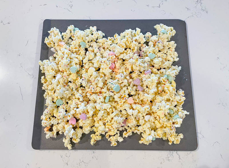 popcorn laying on a baking sheet cooling