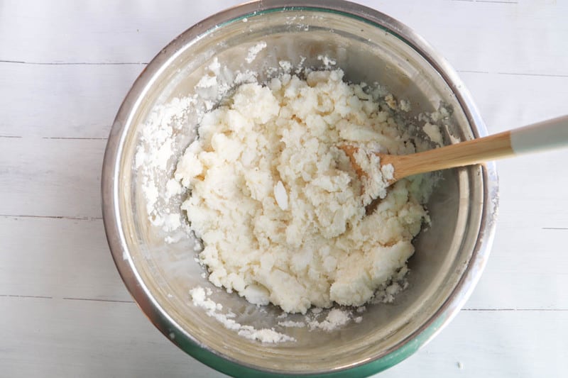 mixing ingredients in a large mixing bowl