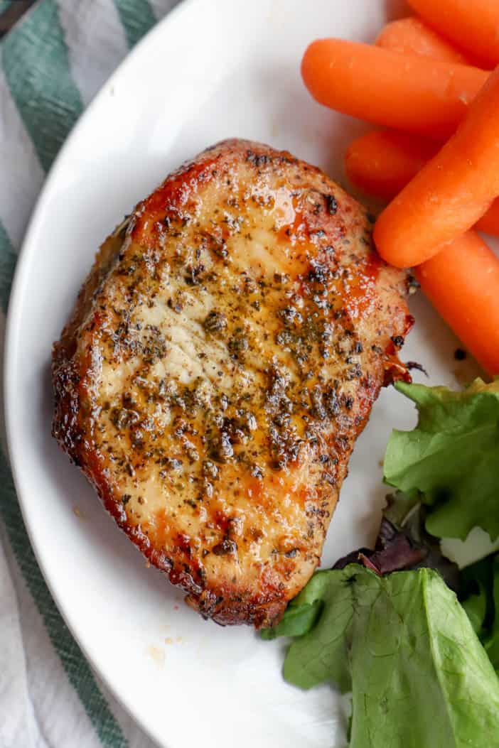 Air Fryer Pork Chops on a white plate.