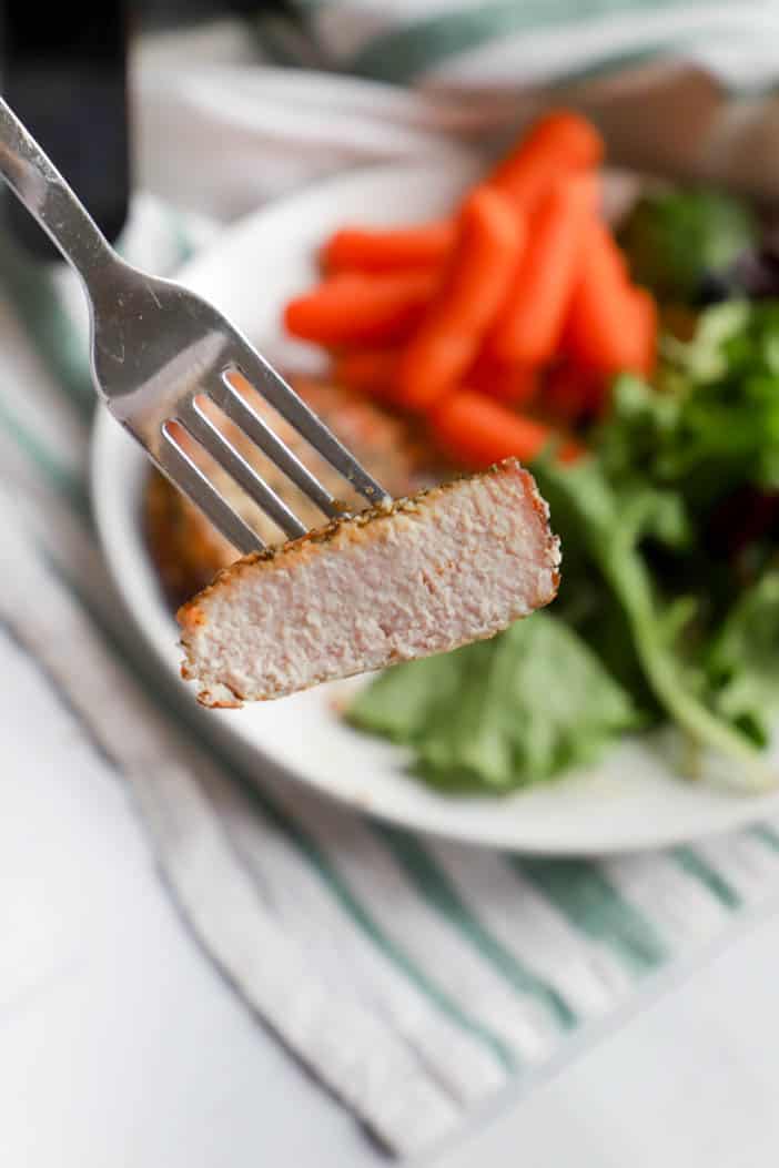 Air Fryer Pork Chops sliced on a fork.