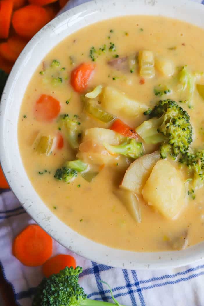 close up of Broccoli Potato Cheese Soup loaded with veggies
