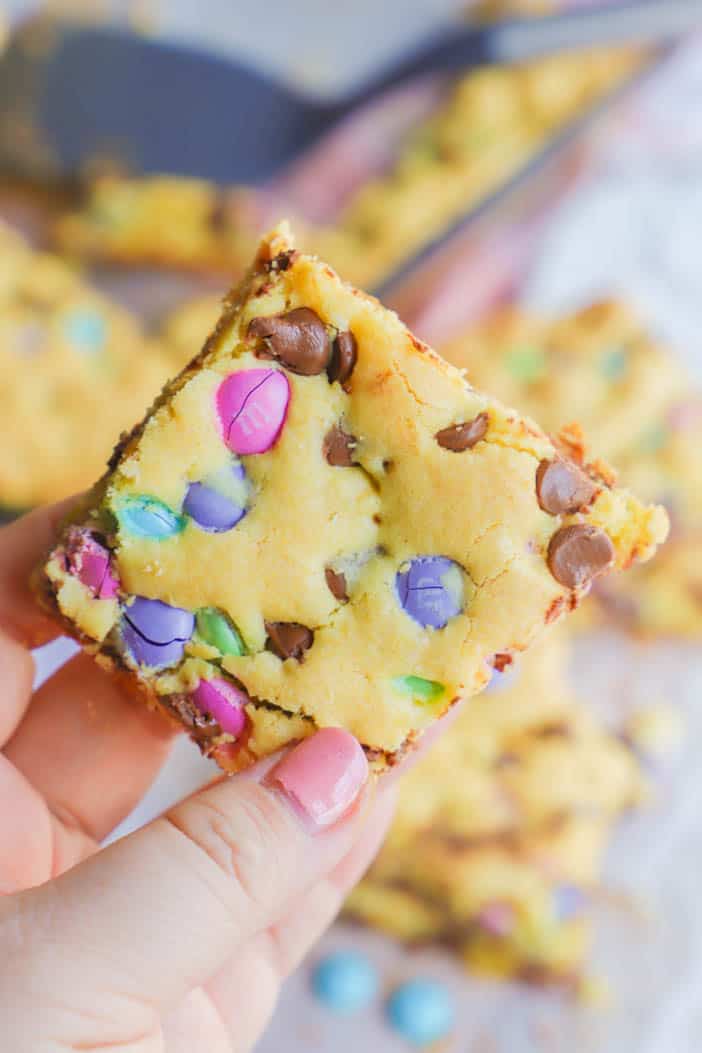 holding Easter Cake Mix Cookie Bars in my hand