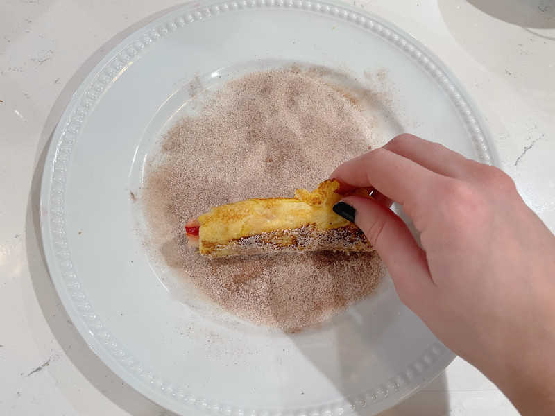 rolling roll up in cinnamon sugar mixture.