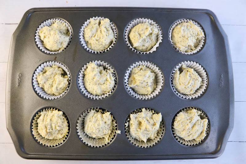 adding batter to muffin tin