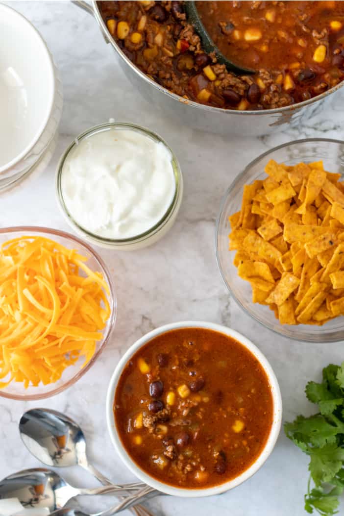 soup with sour cream and cheese in bowls.