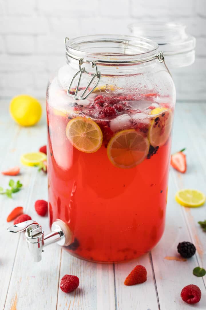 Sparkling Berry Lemonade ready to serve with fresh fruit inside