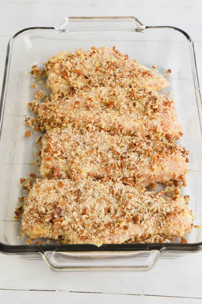 chicken with pecans in baking dish