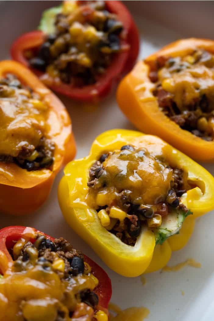 Mexican Stuffed Peppers in a white casserole dish