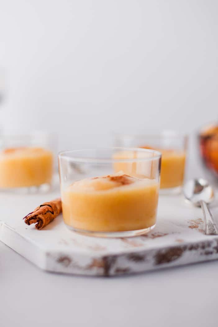 Slow Cooker Cinnamon Applesauce in a small clear glass jar