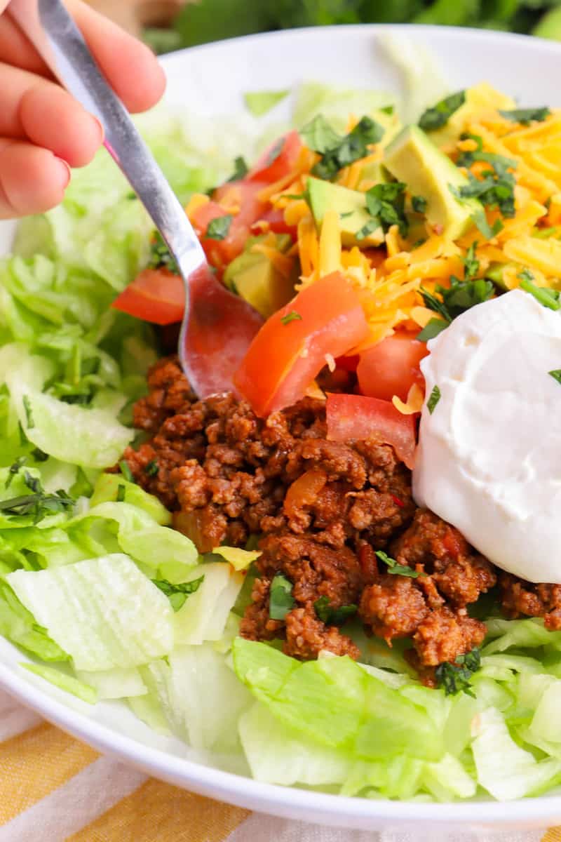 closeup of taco salad being scooped with a fork